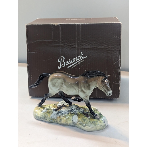 156 - A Beswick model of Przewalski's Wild Horse, dated 1005, limited edition no 684/1000, together with b... 