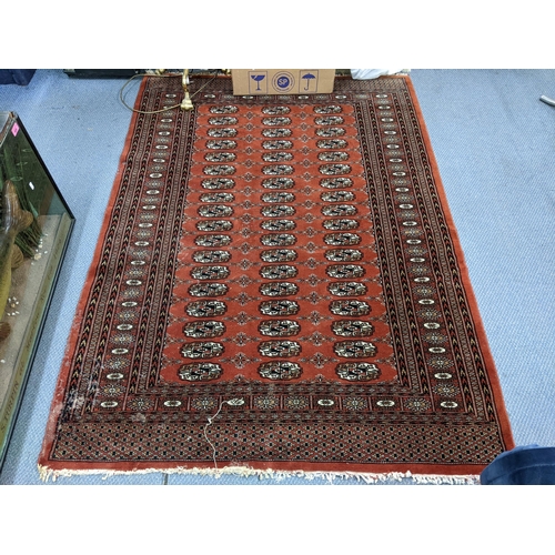 186 - A red 20th century rug having elephant gull design, 180cm x 128cm
Location:A3B