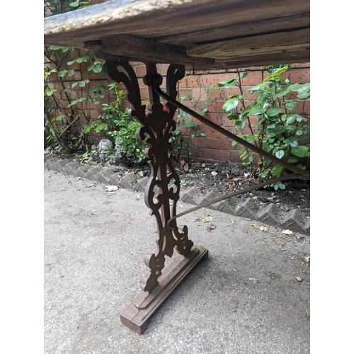 65 - A Victorian cast iron rectangular pub table base having a rectangular wooden top, A/F, 70cm x 107cm,... 