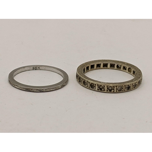 68 - Two white metal bands to include one inset with paste stones and an 18ct gold band 1.2g, Location:CA... 