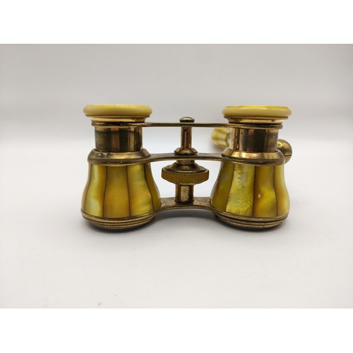 200 - An early 20th century French yellow mother of pearl opera glasses, retailed by H C Abbott & Bro, Bir... 