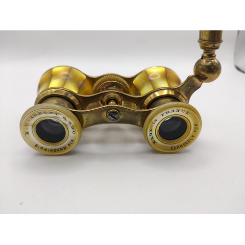 200 - An early 20th century French yellow mother of pearl opera glasses, retailed by H C Abbott & Bro, Bir... 