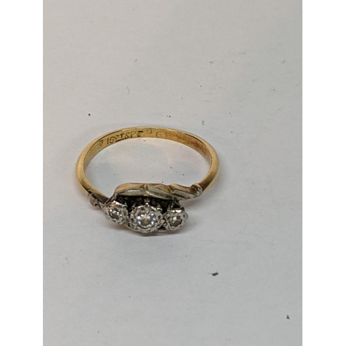 20 - An 18ct yellow gold and platinum set three stone diamond ring, total weight 2.5g
Location: CAB1