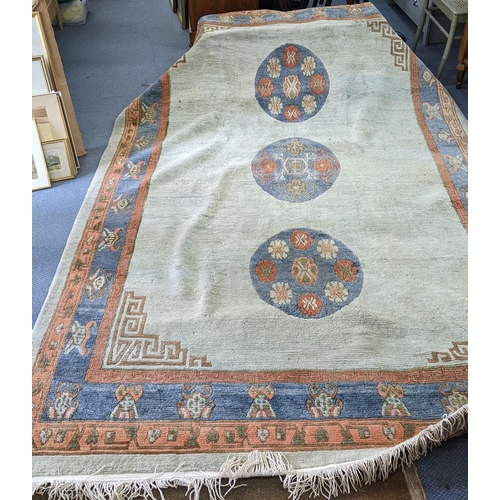 325 - A handmade Chinese carpet with geometric motifs in pastel colours
Location:A1F