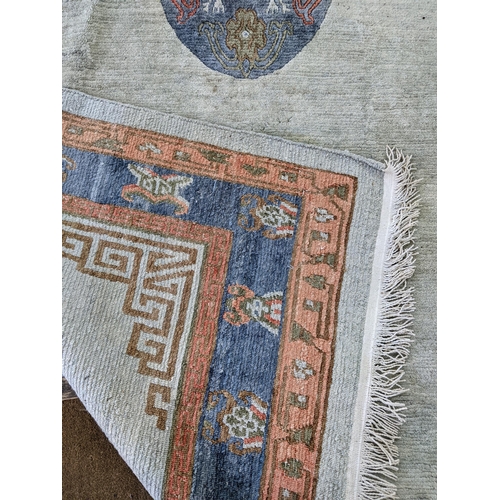 325 - A handmade Chinese carpet with geometric motifs in pastel colours
Location:A1F