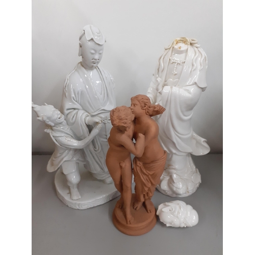 24 - 19th century Blanc de chine Oriental figures A/F, and a terracotta group of an embracing couple, sta... 