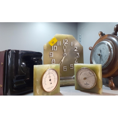 53 - An Onyx desk clock and barometers, together with a vintage oak desk clock in the form of a ships whe... 