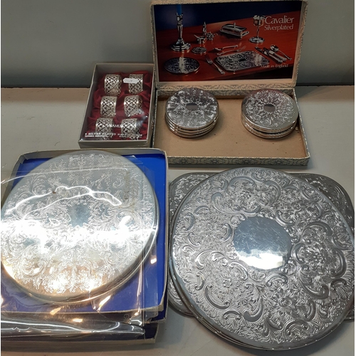 64 - Silver plate to include placemats, a tray, teaware and other items to include metal chargers, Locati... 