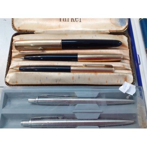 9 - Pens to include a set of three mid 20th century Parker fountain, ballpoint and a pencil cased, A/F, ... 