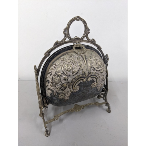 1 - A Victorian silver plated biscuit warmer of shell design having embossed floral design Location:9.1