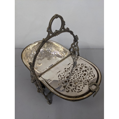 1 - A Victorian silver plated biscuit warmer of shell design having embossed floral design Location:9.1