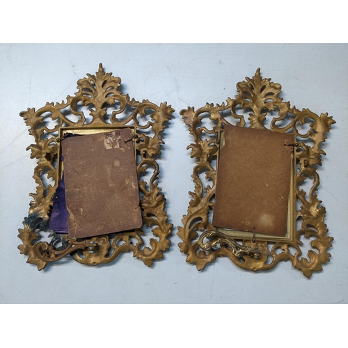 13 - A pair of Victorian gilt metal picture frames decorated with floral scrolls and having easel backs
L... 