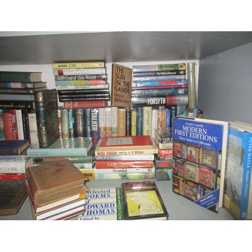 138 - A collection of various books and comics, many signed, to include Peter Scott - Travels Diaries of a... 