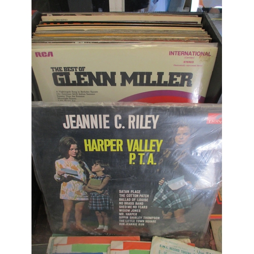 141 - A selection of easy listening and other LPs and singles to include Jeannie C Riley Harper Valley PTA... 