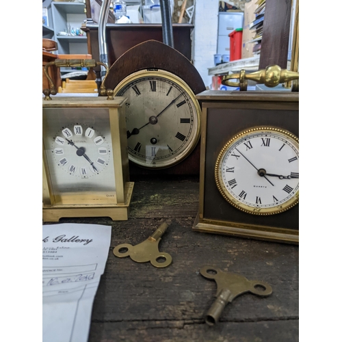 142 - A group of carriage and mantel clocks to include a Garrard & Co five-window brass cased carriage clo... 