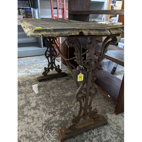 160 - THIS LOT HAS BEEN WITHDRAWN

A wooden plank top pub table on cast iron trestle and base 71cm x 105cm... 