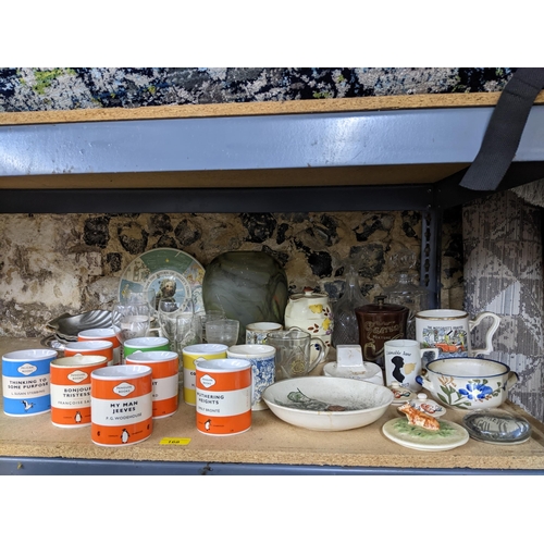 168 - A mixed lot to include various Penguin books mugs, Victorian tobacco jar advertising Garrick Tobacco... 