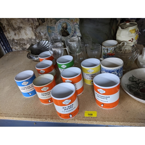 168 - A mixed lot to include various Penguin books mugs, Victorian tobacco jar advertising Garrick Tobacco... 