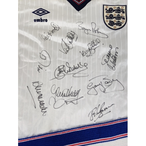 2 - A collection of England Football 1986 memorabilia to include a signed shirt with eleven signatures, ... 