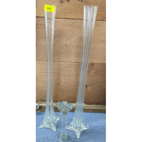 203 - A pair of early 20th century tall clear glass slender vases, and another
Location:RAB