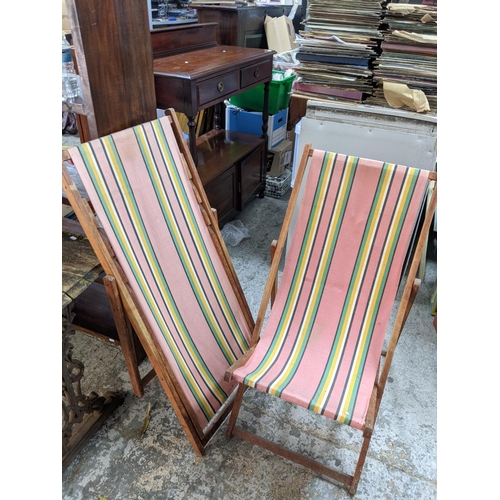 208 - A teak lounger together with a pair of wooden framed deck chairs
Location:G