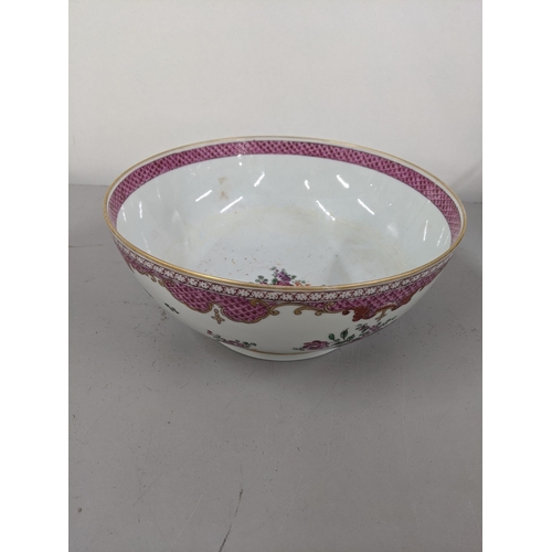 21 - A porcelain bowl in the design of an 18th century Chinese famille rose bowl Location:9.3