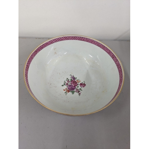 21 - A porcelain bowl in the design of an 18th century Chinese famille rose bowl Location:9.3