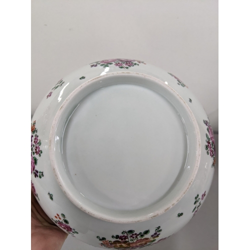 21 - A porcelain bowl in the design of an 18th century Chinese famille rose bowl Location:9.3