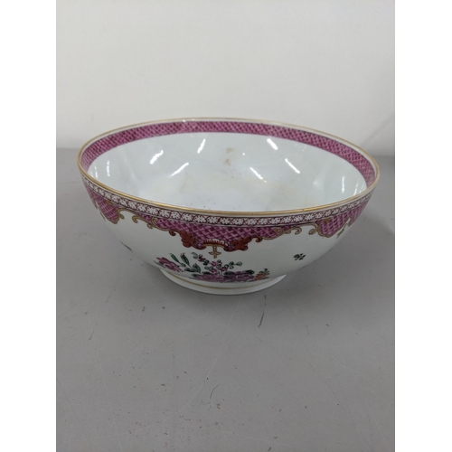 21 - A porcelain bowl in the design of an 18th century Chinese famille rose bowl Location:9.3