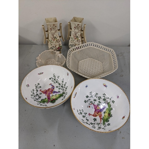 22 - Two Belleek  lattice pierced bowls, together with two porcelain bowls decorated with peacocks and in... 