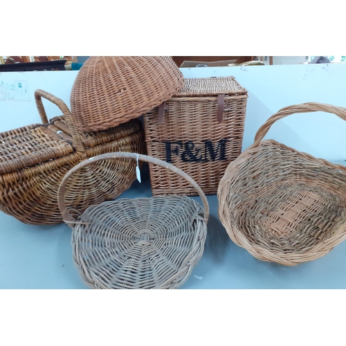 235 - A quantity of wicker baskets to include a Fortnum & Masons basket, a cloche and a picnic hamper
Loca... 