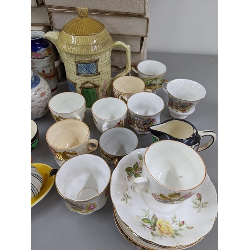 28 - Ceramics to include a Royal Worcester Doughty figure, decorative teapots, collectors plates and othe... 