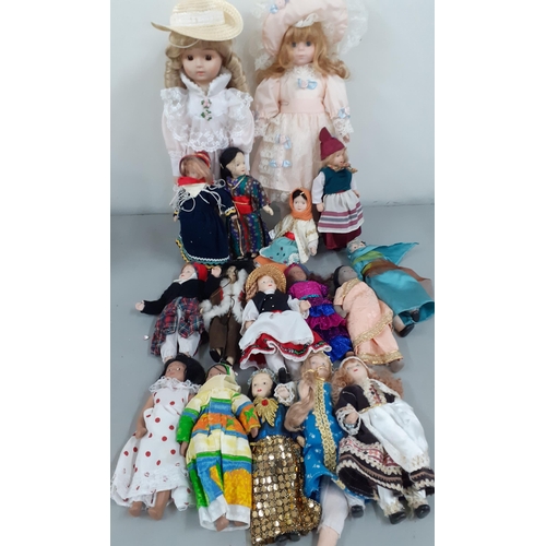 30 - A quantity of worldwide dolls together with an American flyer's helmet bag DLA100-85-C-4545 and boxe... 