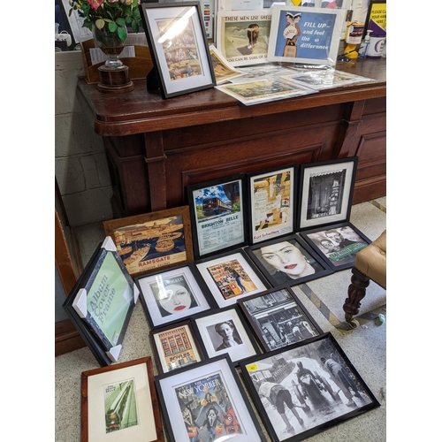 303 - A selection of framed and glazed reproduction train and travel posters, photographs, and New Yorker ... 