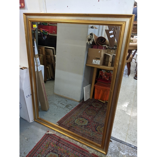 313 - A gilt and silvered coloured framed wall mirror with rectangular mirrored plate 135cm x 103cm Locati... 