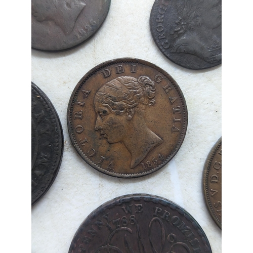 318 - A collection of George II and later coins and tokens to include 1858 Penny, 1854 Halfpenny, 1754 Far... 