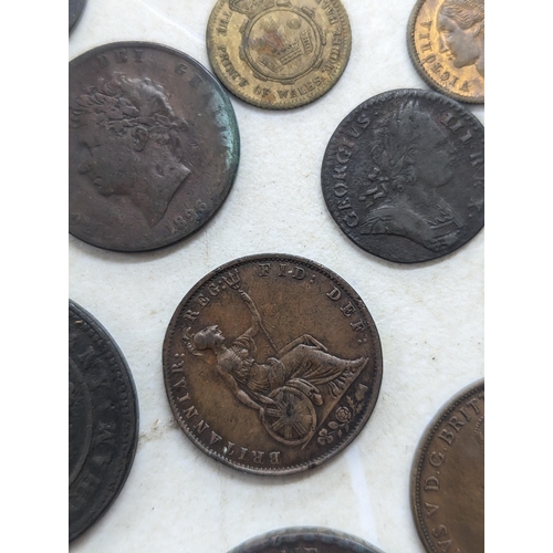 318 - A collection of George II and later coins and tokens to include 1858 Penny, 1854 Halfpenny, 1754 Far... 