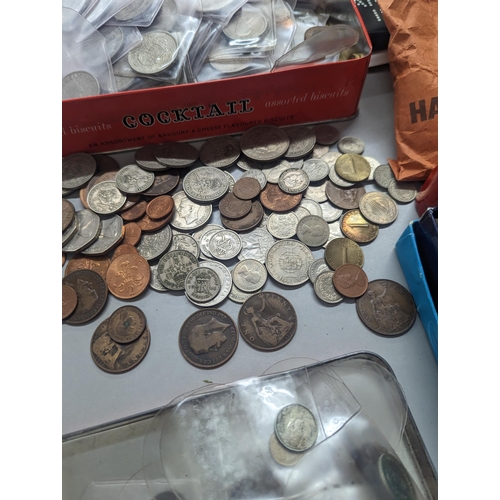 324 - A large quantity of British and world coinage to include Victorian and later pennies, 1960s tubes of... 