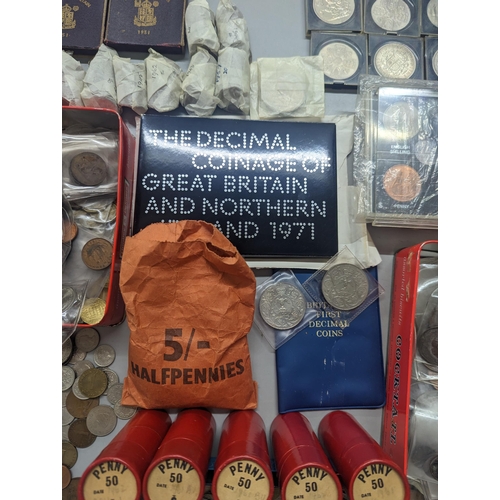 324 - A large quantity of British and world coinage to include Victorian and later pennies, 1960s tubes of... 