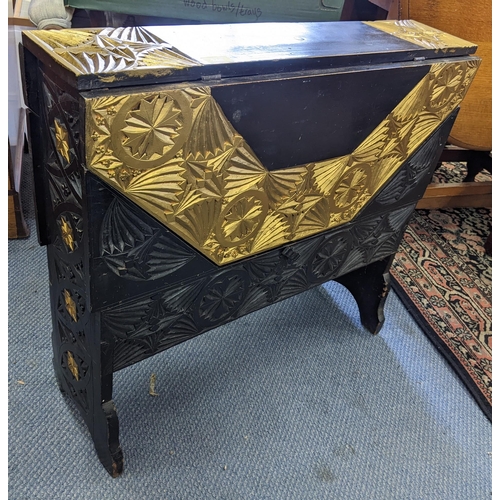 340 - A 1940's swivel top table with inset decoration pattern, some gilding, a swivel and lock top, 29inch... 