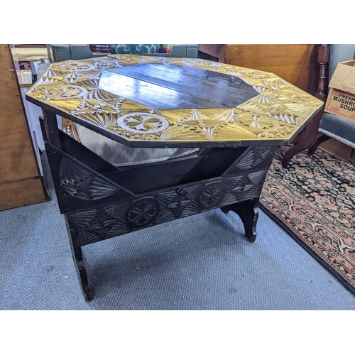 340 - A 1940's swivel top table with inset decoration pattern, some gilding, a swivel and lock top, 29inch... 