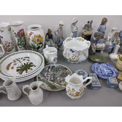 369 - A mixed lot to include Nao figures, Wedgwood Jasperware, Parian jugs, Portmeirion Botanic Garden and... 