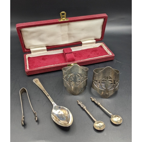 69 - Silver to include a pair of napkin rings, two salt spoons, sugar tongs and spoon, 101g, Location:CAB... 