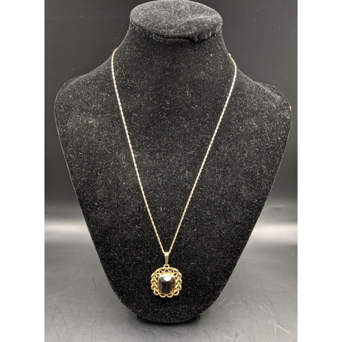 70 - A pendant with a smokey quartz set in a 9ct gold frame on a fine chain, total 8.2g, Location:CAB1