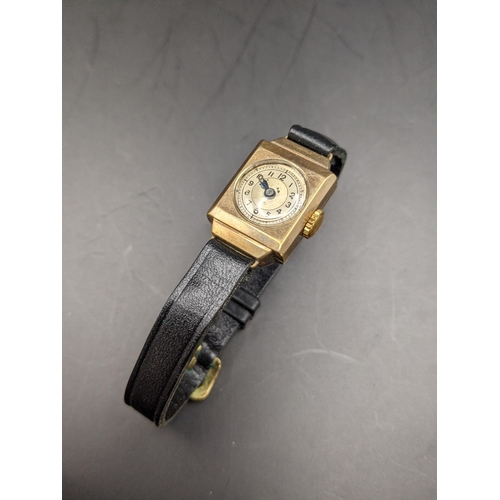 71 - A ladies 9ct gold cased wristwatch on a leather strap, Location:CAB1