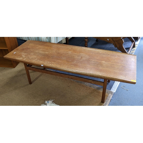 95 - A mid 20th century Dalescraft teak coffee table of rectangular form with curved edges, 44.5h x 151w,... 