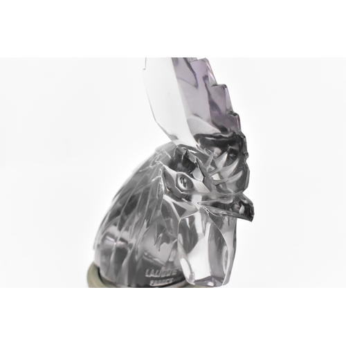 14 - A Lalique 'Tete de Coq' Car Mascot, in clear lilac glass modelled as a cockerel head, with metal mou... 