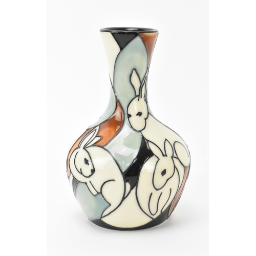 34 - Two Modern Moorcroft pottery bud vases, one in the 'pole to pole rabbits' pattern designed by Kerry ... 