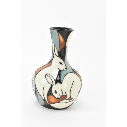 34 - Two Modern Moorcroft pottery bud vases, one in the 'pole to pole rabbits' pattern designed by Kerry ... 