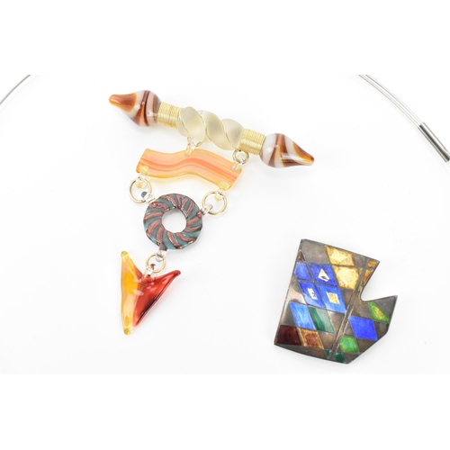 52 - Three modernist jewellery pieces, to include a necklace, a glass lampwork brooch, and a silver and e... 